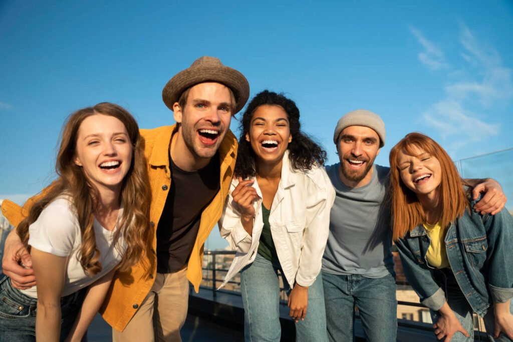 Group of friends laughing and having fun, social support system.